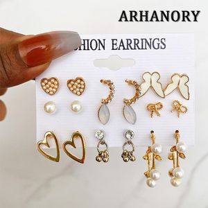 ARHANORY Ensemble de 9 boucles d'oreilles mode perles imitation strass papillon cœur clous pour femme - Or