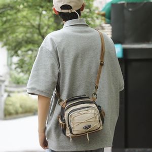 Sac à dos unisexe, sac bandoulière pour trajets quotidiens, sac multifonction à compartiments multiples.