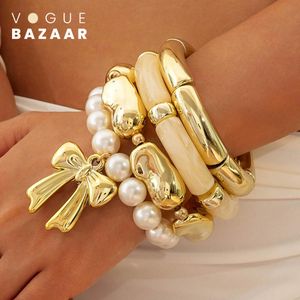 VOGUE BAZAAR Set de 4 bracelets métalliques au style européen tendance avec nœud en perle, design irrégulier